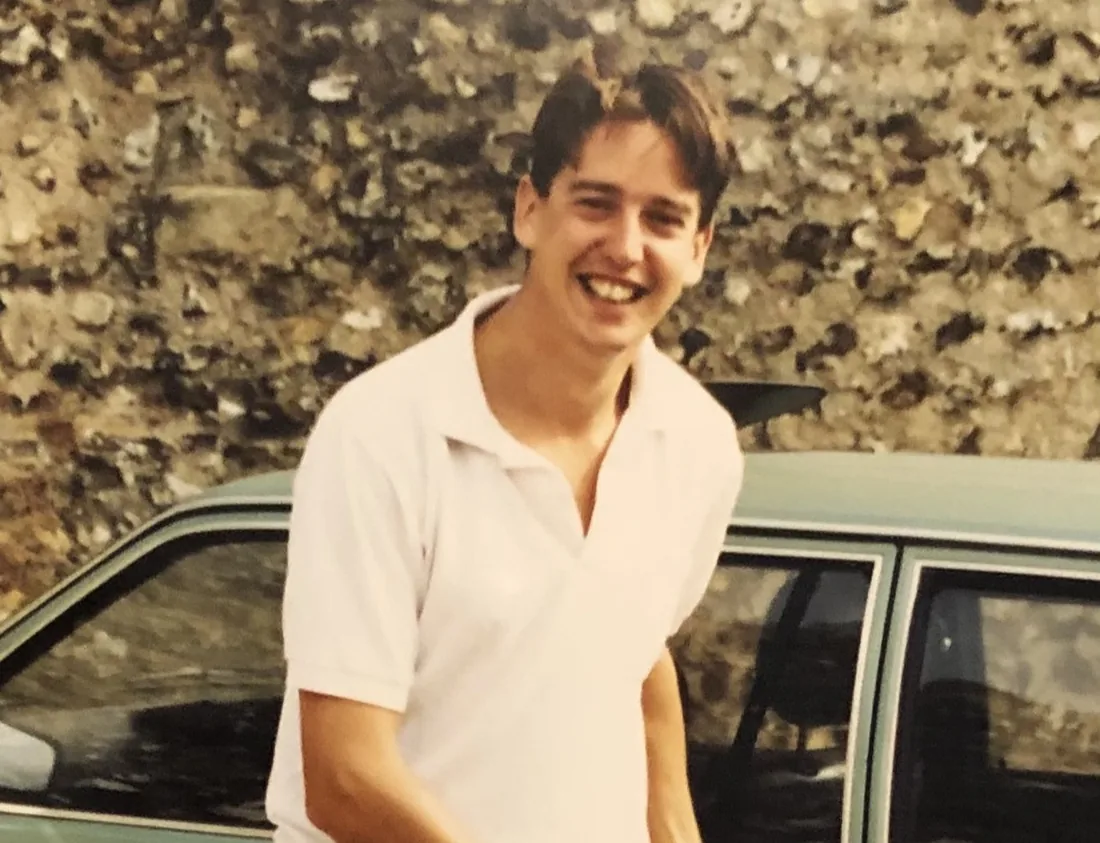 Carl’s dad as a young man, smiling in front of the family car